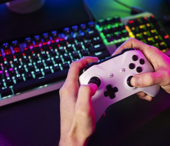 high-angle-hands-holding-controller